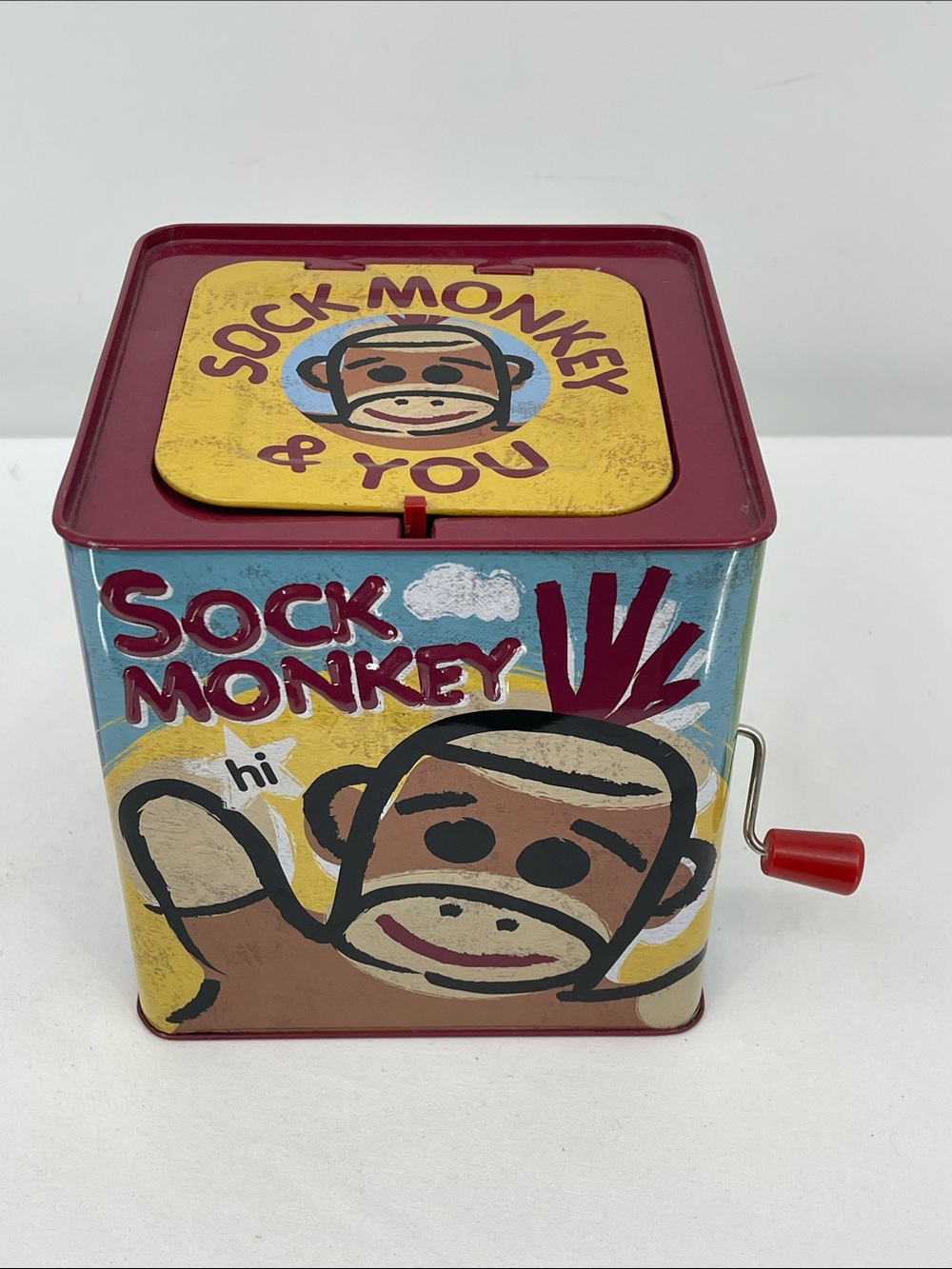 Sock Monkey Tin Hand-Crank Music Box - Red/Yellow/Blue